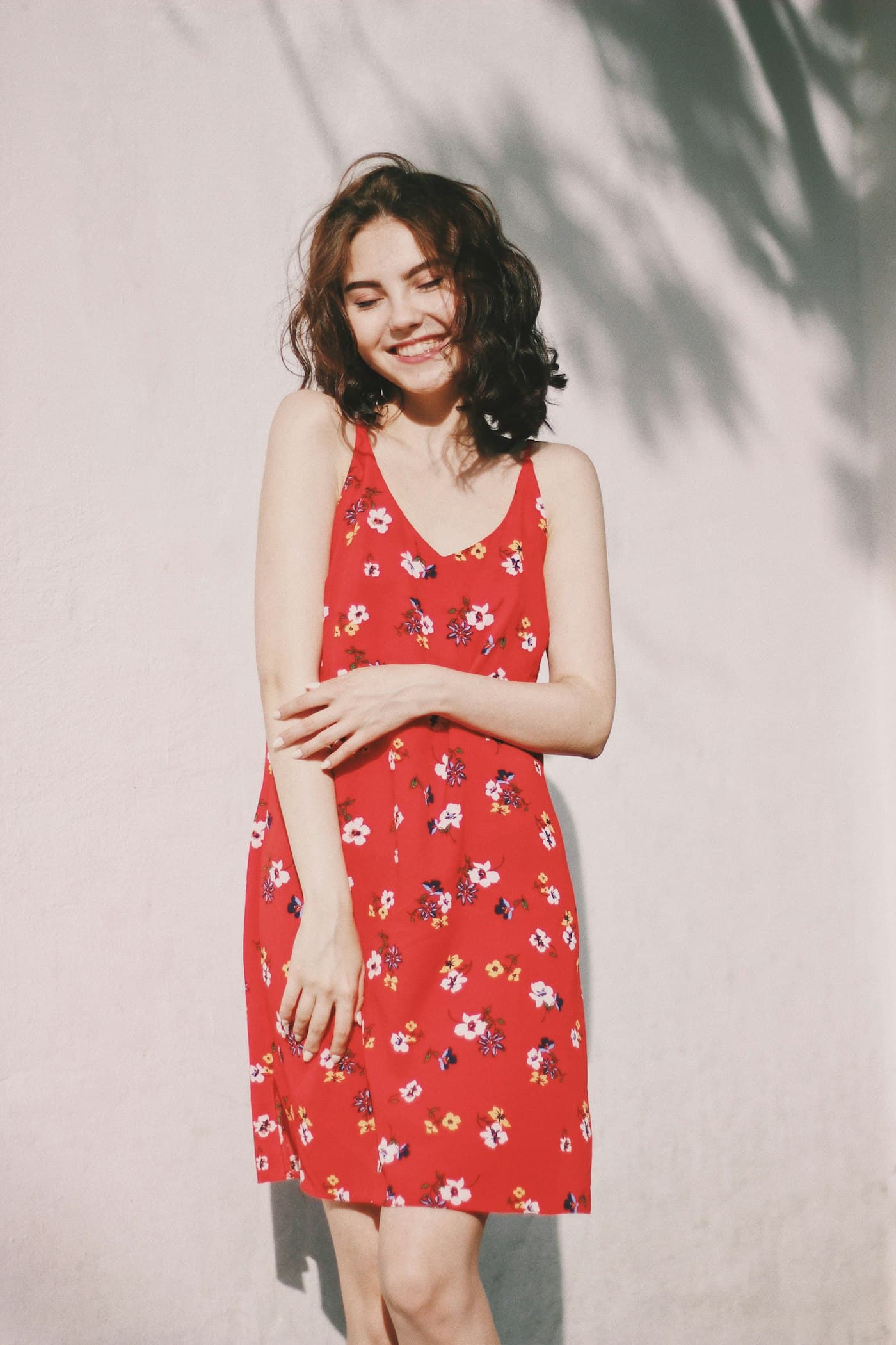 Woman in a red floral midi dress