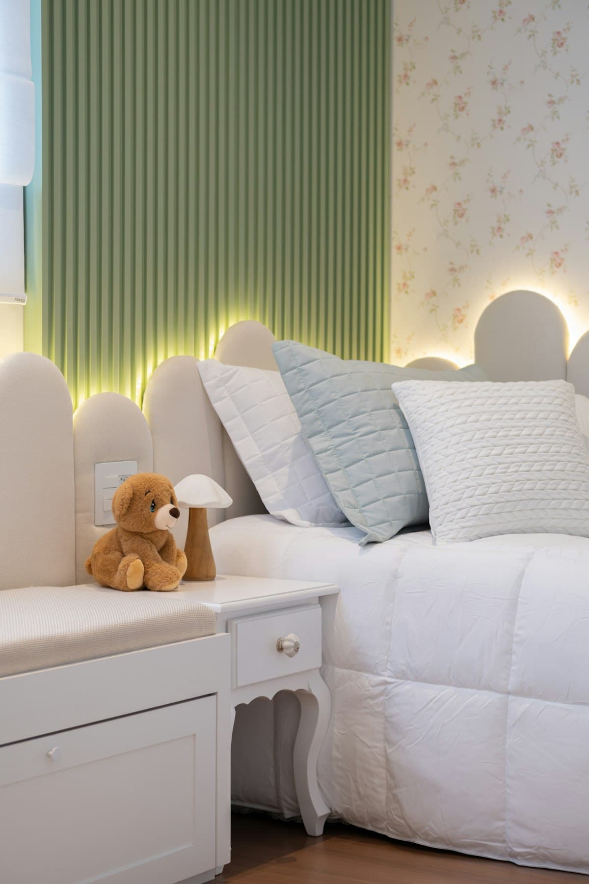 A bright children's room with a white shelf of toys